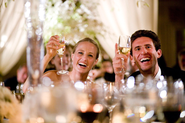 photo by Washington D.C. wedding photographer Paul Morse - happy couple toasting at reception 